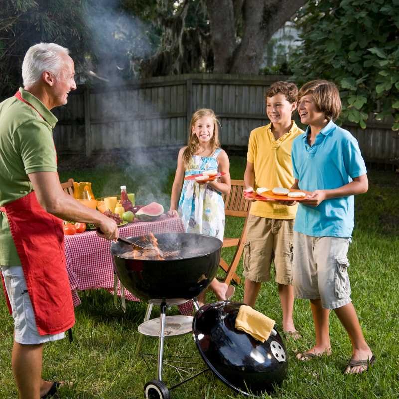 Family grilling in the backyard